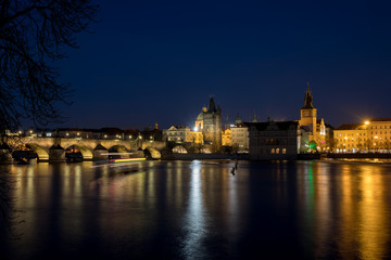 Fototapeta na wymiar Night photo of Prague Charles Bridge and Powder tower
