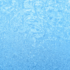 Fototapeta na wymiar beautiful patterns on winter glass, festive background, close up