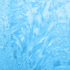 beautiful frost patterns on window, festive background, close up