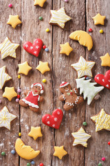 Various Christmas gingerbread on a wooden background. vertical top view 