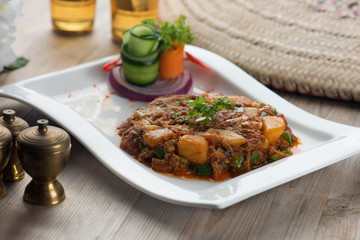 oqda , fried potatoes with meat popular arab food