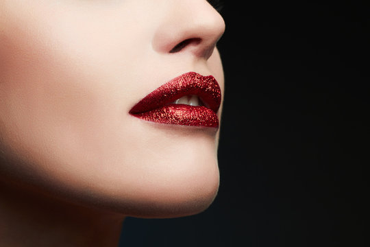 Sexy Lips. Beauty Red Lips Makeup Detail. Beautiful Sensual woman. glitter lips,lipstick or Lip gloss