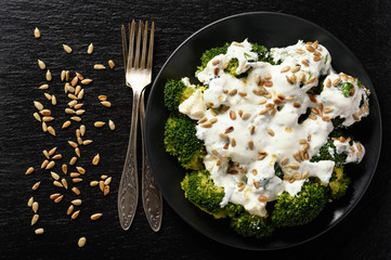 Broccoli salad with feta cheese, garlic dressing and sunflower seeds.