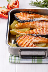 Grilled salmon steak with potatoes