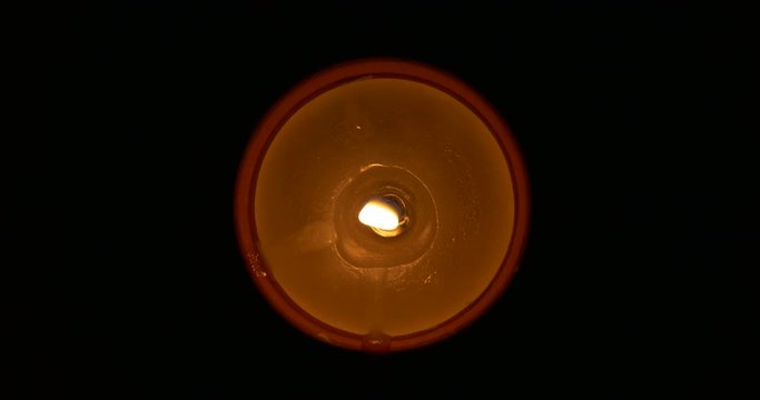 Lighted oil candle from above