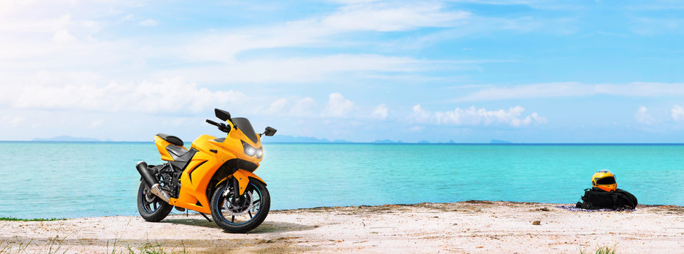Panoramic scene of sport motorcycle at the beach