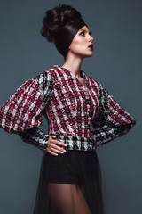 Beautiful girl in evening dress with avant-garde hairstyles. Beauty the face. Photos shot in the...