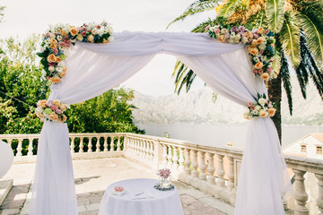 pink wedding arch with flowers