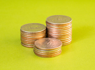 Stack of US. dollar coins on green background