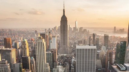 Aerial view of Manhattan skyline. Zoom out. Sunset. Vintage. Time lapse.