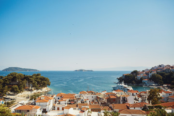 Naklejka premium Sea spreads before beautiful Greek city