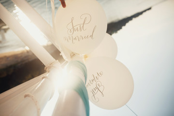 Look from above at white balloons with letterings 'Just married'