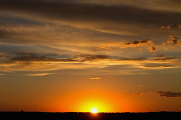 Bright landscape with the setting sun