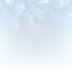 Winter abstract background with falling snowflakes and sparkles.