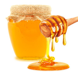 dripping honey and honey in a jar isolated