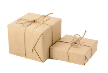 Gift boxes or mail parcels, wrapped with kraft paper and twine isolated