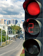 red traffic lights and people.
