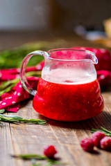 raspberry tea in glass teapot