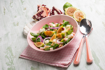 mixed salad with valerian figs cheese and pomegranate