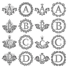Vintage monograms set of letters A, B, C, D. Heraldic coats of arms, symbols in floral round and square frames.