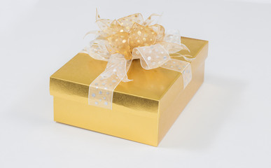 Gold christmas gift box on white background