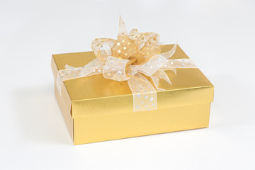 Gold Christmas gift box on white background