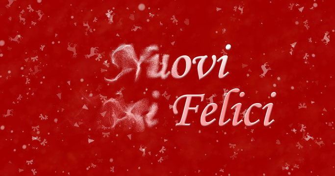 Happy New Year text in Italian "Nuovi anni felici" turns to dust from bottom on red background