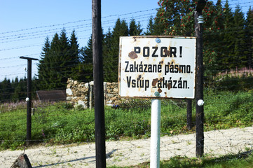 Remains of iron curtain on Czech-German border, an unique original rest of the iron curtain electric fence. Inscription on the sign means - beware! forbidden zone, no entry