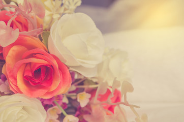 Beautiful flowers on bed in bedroom vintage tone