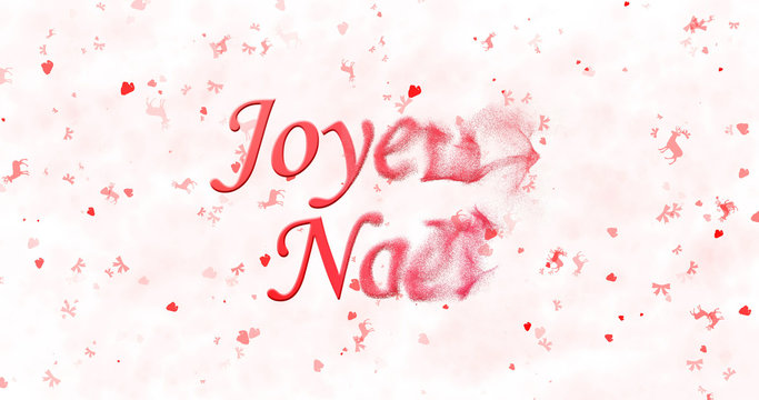Merry Christmas text in French "Joyeux Noel" turns to dust from right on white background