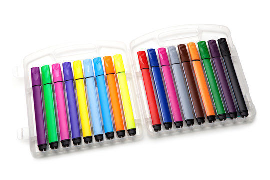 colored markers in box on the white background