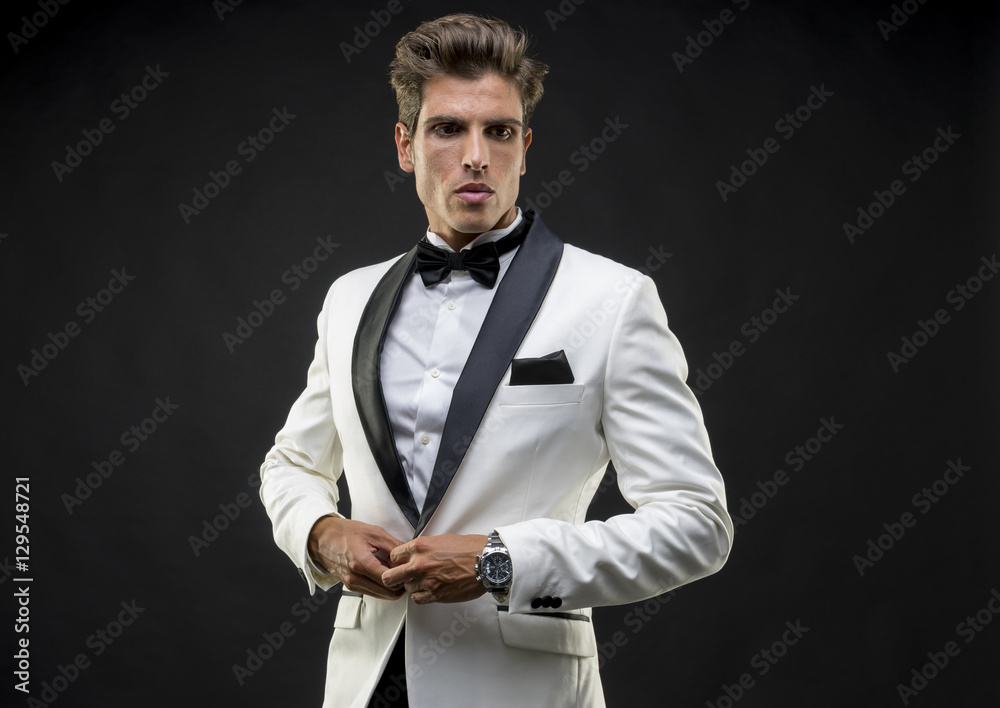 Wall mural wedding, elegant and handsome man dressed in tuxedo for new year