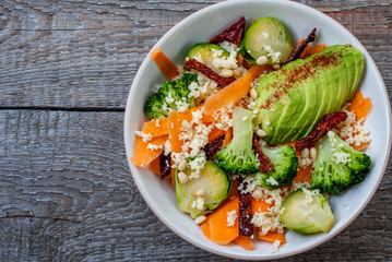 Couscous with broccoli, avocados, carrots, Brussels sprouts, dried tomatoes and pine nuts. . Perfect for the detox diet or just a healthy meal.  Love for a healthy raw food concept.