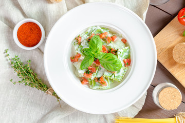 Ravioli pasta from green dough stuffing