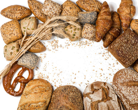 Frame Of Various Types Of Bread And Rolls, Above View.