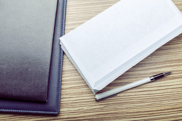 Photo of blank envelope on a  wooden background