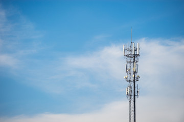 Cell phone tower, Telecommunication antenna, Mobile phone tower, signal distributor with blue sky in background