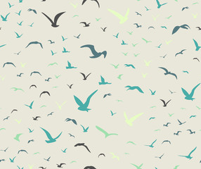 Blue colored seagulls silhouettes as seamless pattern