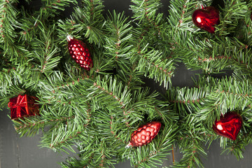 Happy New Year decorationand spruce and christmas balls on a black table