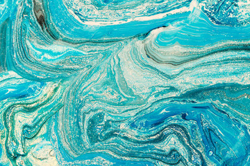 Blue marbling texture. Creative background with abstract oil painted waves, handmade surface. Liquid paint.