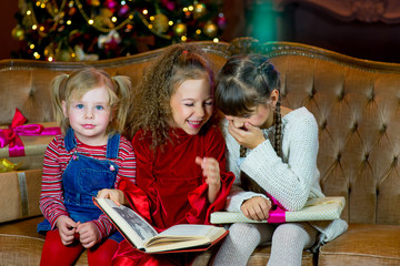 Santa Claus and group of girls reading a book