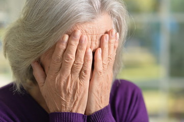 Fototapeta premium Stressed senior woman