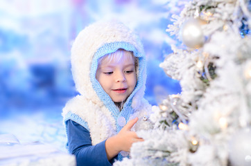 cute baby girl  decorated Christmas tree