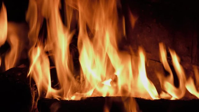 Fire Logs Burning In A Fireplace