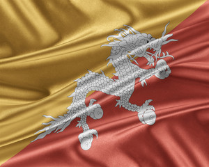 Bhutan flag with a glossy silk texture.