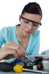 Female computer engineer repairing computer motherboard