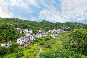 Fototapeta na wymiar Landscape of village in mountains at Hunan province ZhangJiaJie