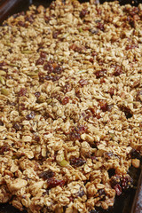 A tray of home made granola baking in the oven