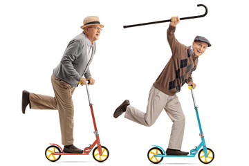 Obraz premium Two overjoyed seniors riding scooters