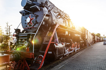 The old Soviet locomotive at sunset